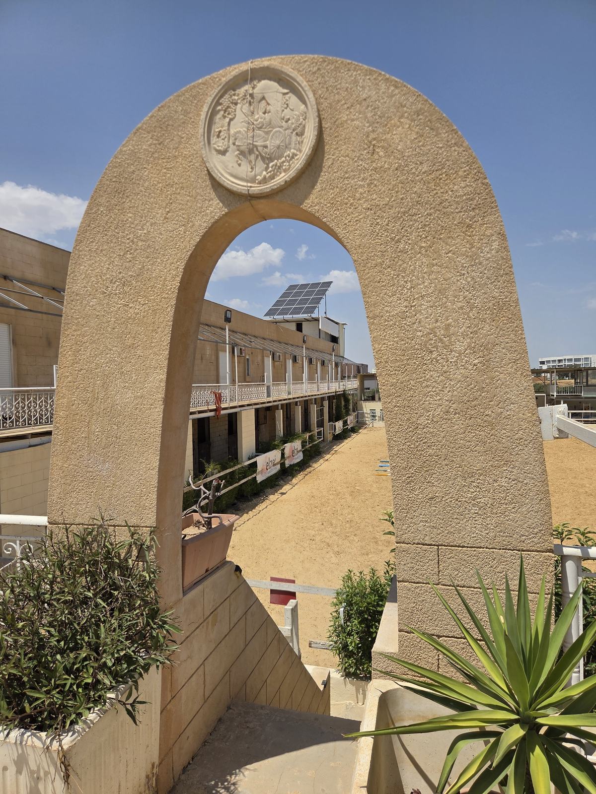 The stone arch leading down to the arena